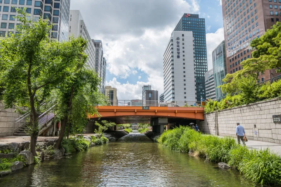 orange bridge crossing Cheonggyecheon stream Seoul