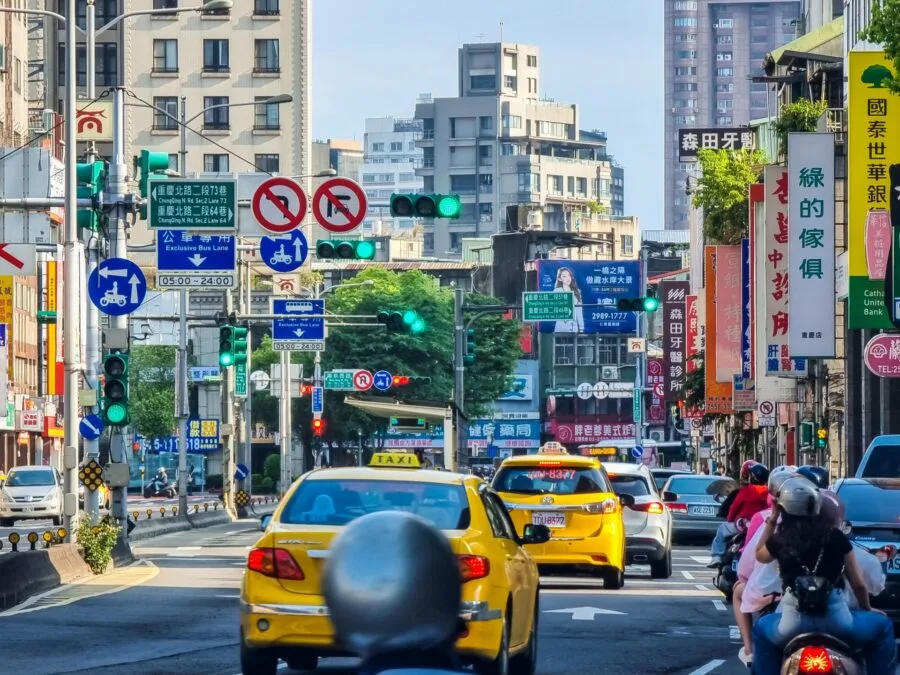 yellow taxis driving on the streets of taipei