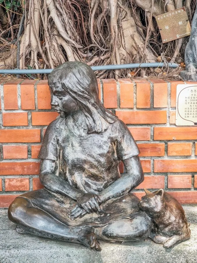 sculpture little girl and her cat tamsui new taipei taiwan