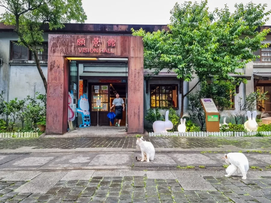 cats in front of vision hall houtong museum taiwan