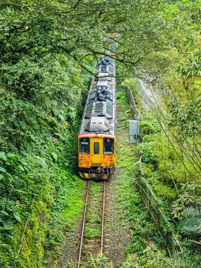 railway passing next to shifen waterfall taiwan
