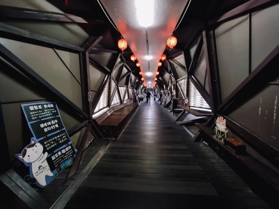 footbridge above rails village houtong taiwan