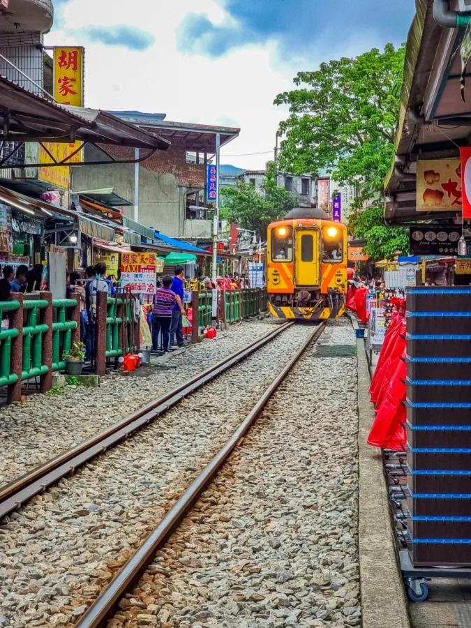 train passing shifen old street taiwan