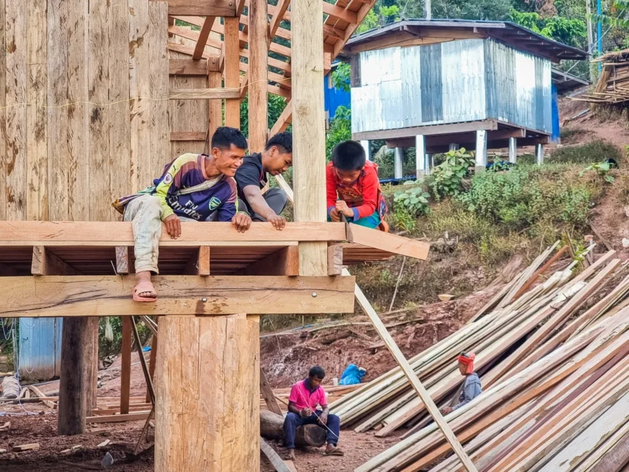 workers building houses village ban pa kam nan thailand