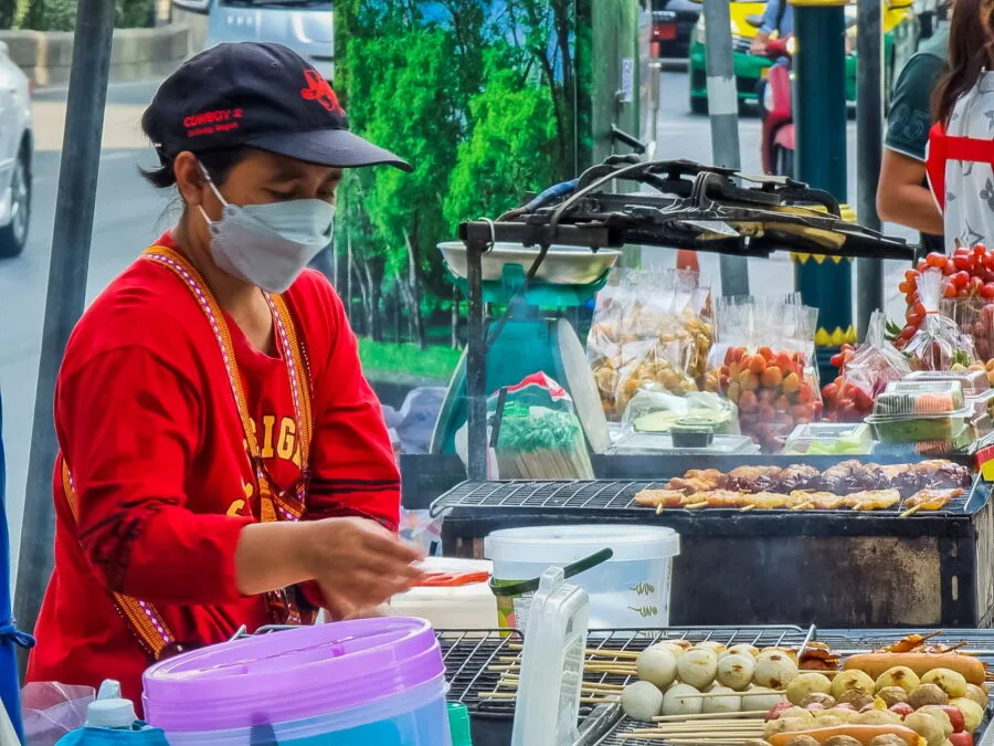 seller of small skewers on the street of Thailand