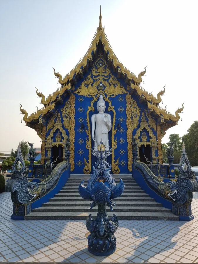 standing buddha back wat rong suea ten blue temple chiang rai