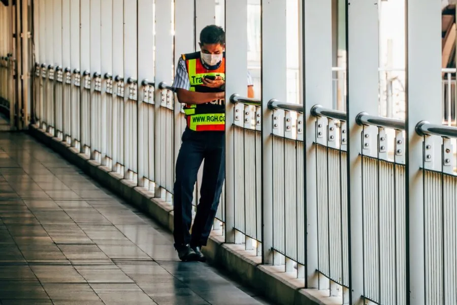 security guard on footbridge between Bangkok malls