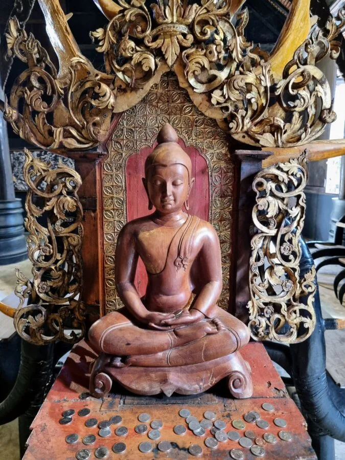 small wooden Buddha at the Baan Dam Museum, Chiang Rai