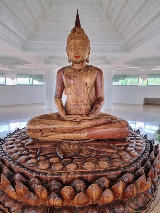 wooden statue inside chedi wat huay pla kang chiang rai