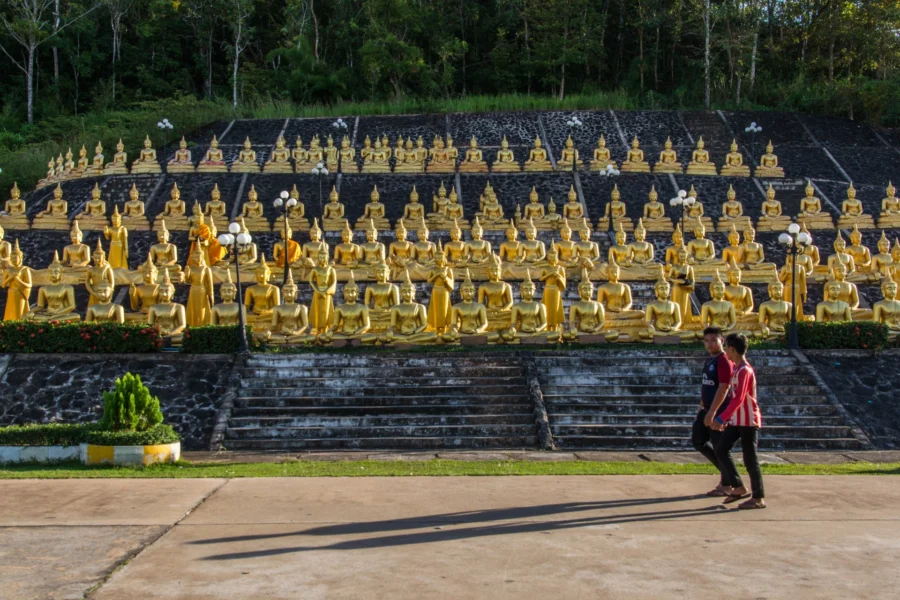 Buddha statues at the entrance to Wat Phousalao Paksse