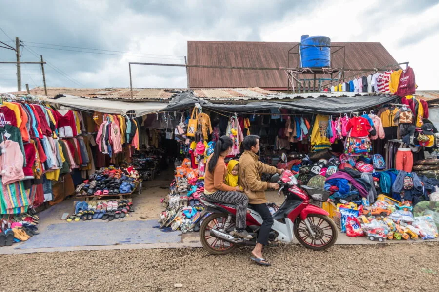 family on motorbike paksong market laos