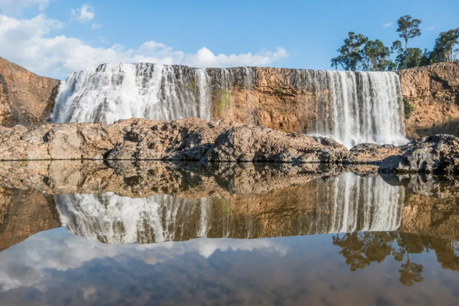 reflection at the sae pong lai waterfall bolovens plateau laos