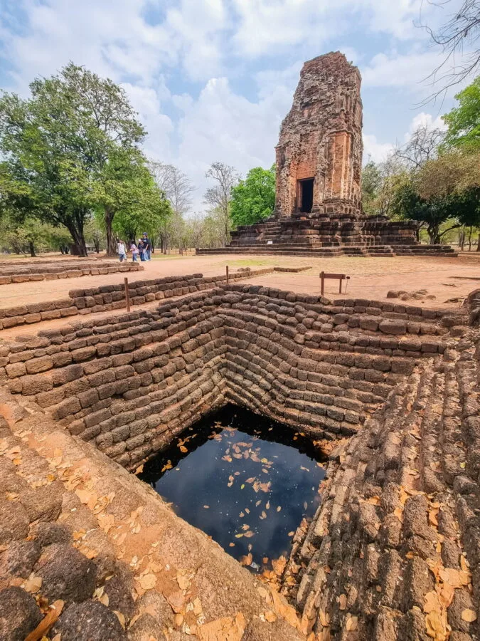 old reservoir in front of prang si thep si thep historical park